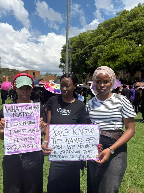 TruCam members at a GBV awareness march holding protest placards