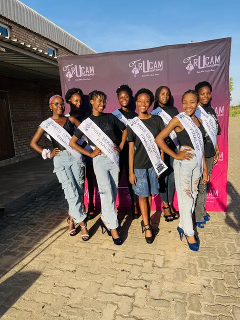 Miss Sekgosese contestants posing in front of the TruCam banner